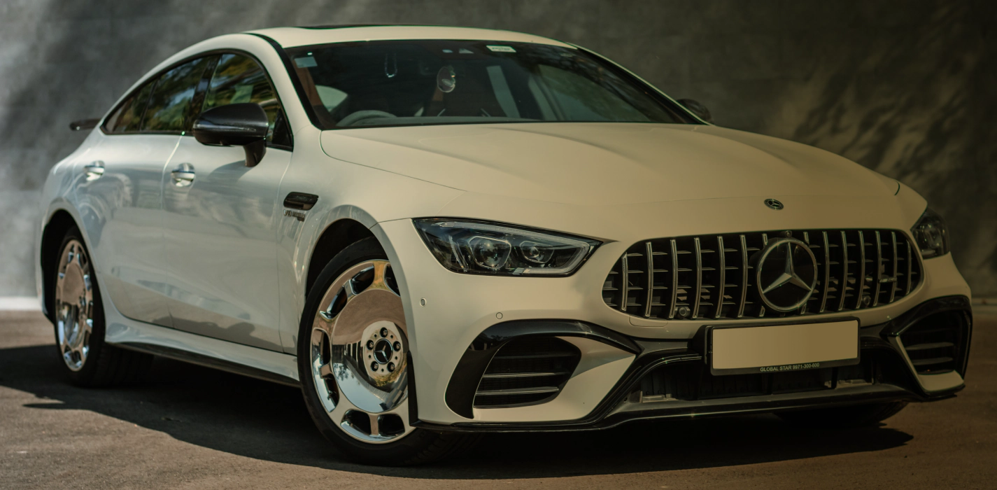 parked white mercedes